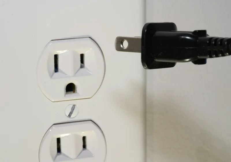 Electrician installing an outlet